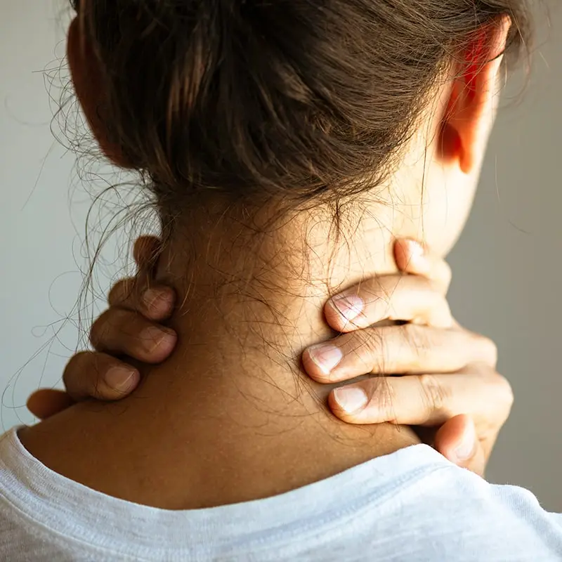 woman who needs chiropractic care for neck pain
